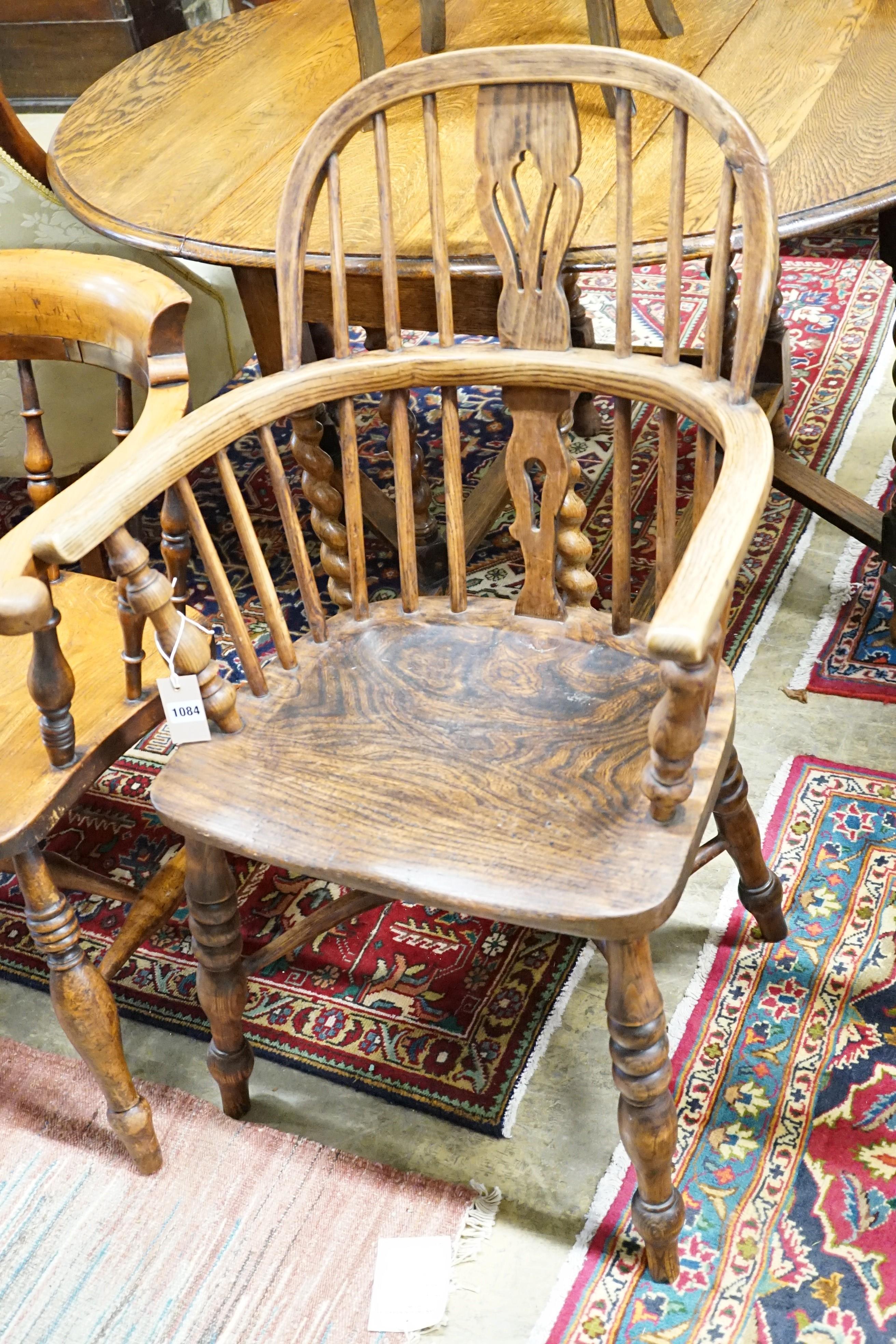 An early 19th century oak, elm and ash Windsor elbow chair, width 57cm, height 94cm